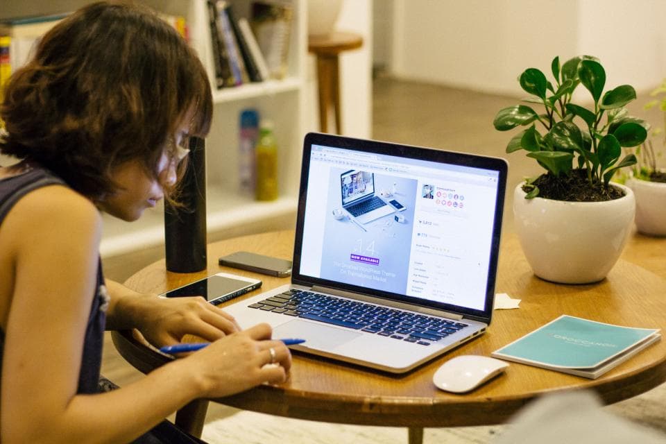 A student learning online at home on a laptop