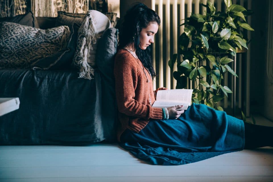 A student reading and revising at home